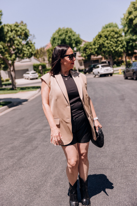 Embracing Edgy Elegance with An Oversized Vest and Leather Shorts